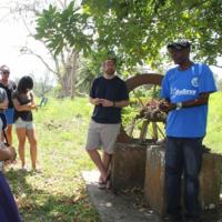 Students working with a local community member in Jamaica