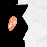  &quot;I Voted&quot; sticker on a coat lapel