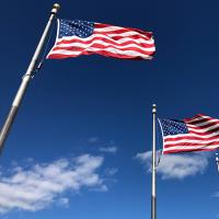  Two American flags on poles