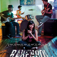 Movie poster: person sits crossed legged with band playing behind