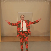  Man wearing a red suit, arms raised