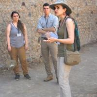 Associate professor Caitlín Barrett takes the Casa della Regina Carolina Project group on a tour of Pompeii.