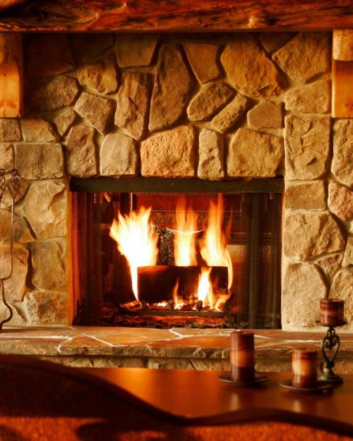 Stone fireplace, lively flames