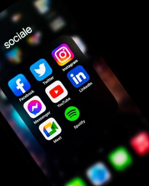 Social media icons glow on a smart phone