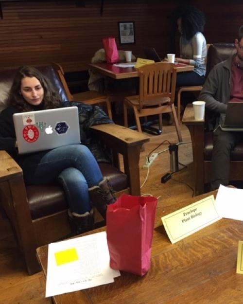 People work on laptop computers in a cozy room
