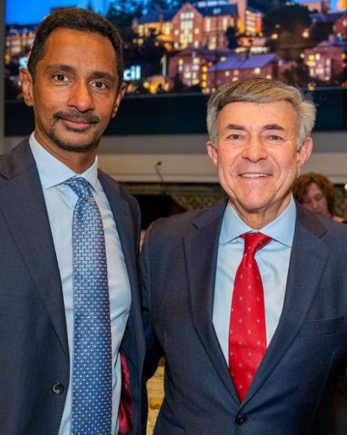 Three people wearing suits