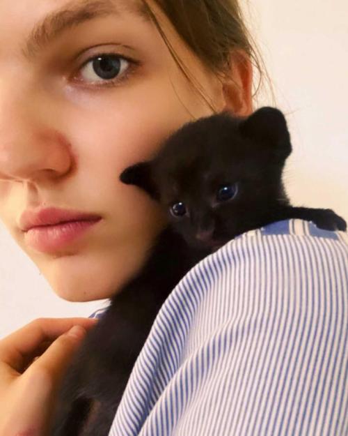 woman with kitten on her shoulder