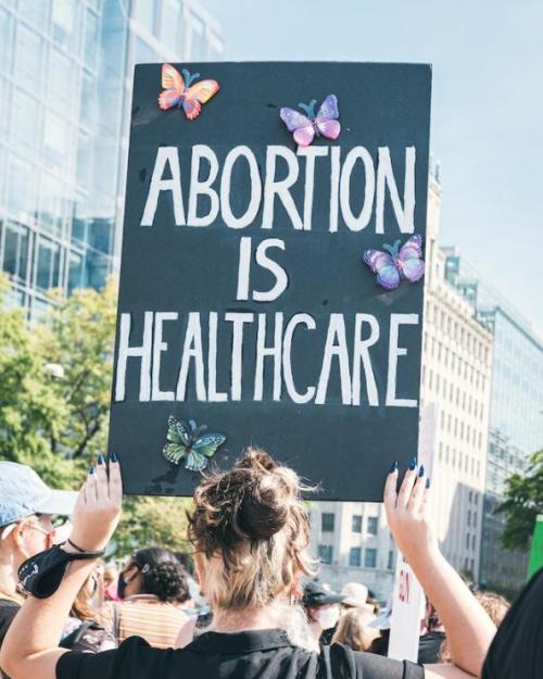 		Person holding sign: 'Abortion is Health Care"
	