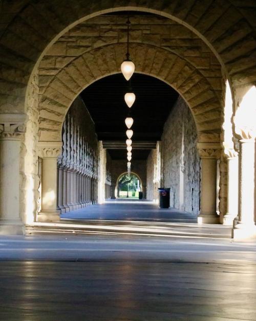 Arched hallway with sunlight