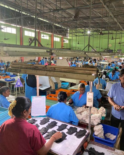 people working in shoe factory