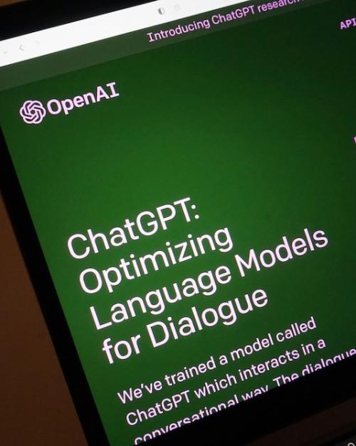 		computer screen showing the OpenAI log and text about ChatGPT
	