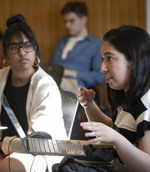 Two women students talking