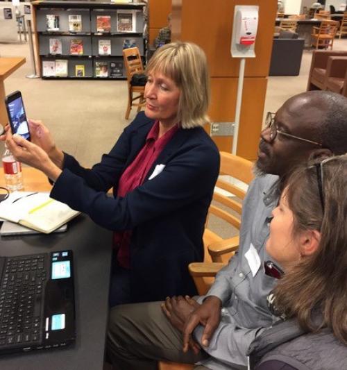  Faculty learning how to use a smartphone to share infrmation