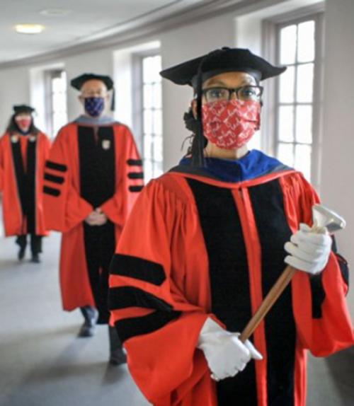 Three people in academic robes