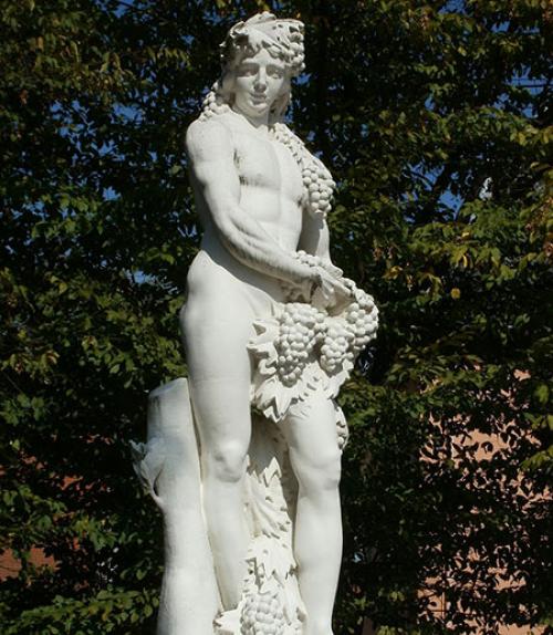  Statue of Bacchus holding bunches of grapes