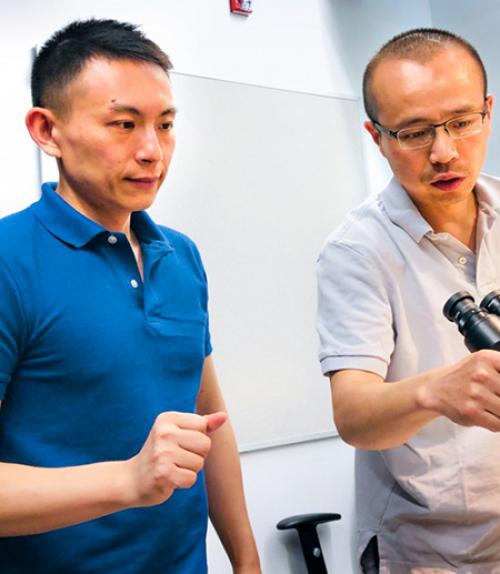  Xianwen Mao, left, and Peng Chen, the Peter J.W. Debye Professor of Chemistry, are pictured in the microscope room in Olin Research Laboratory.