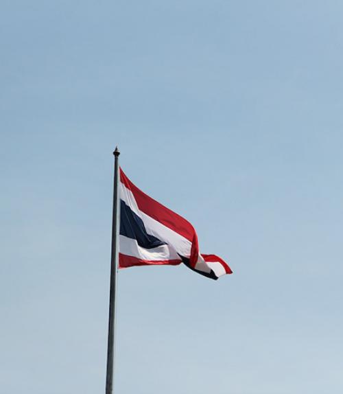  Flag of Thailand against a pale blue sky