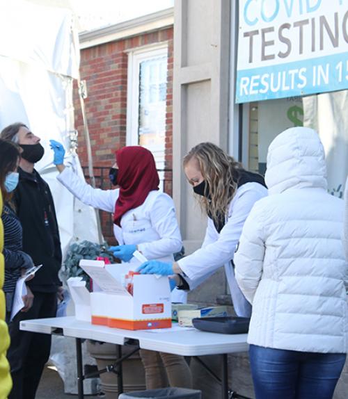 Person administering outdoor medical tests