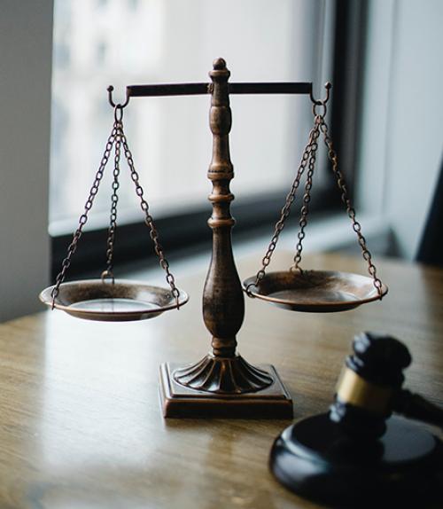 Scale and gavel on a desk