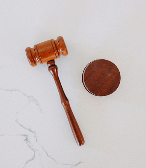 Brown gavel on white background