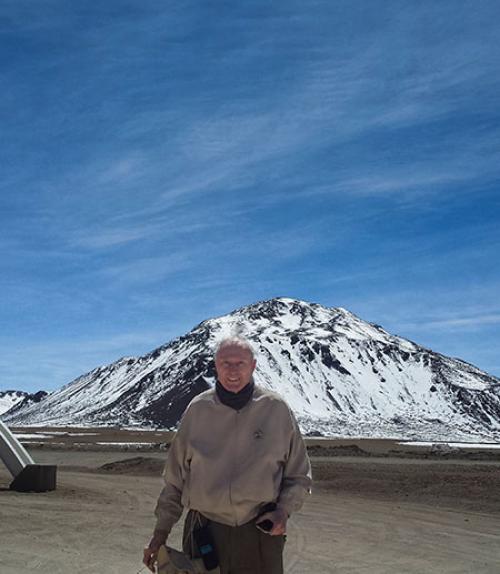 Fred Young standing in front of snow-covered mountain