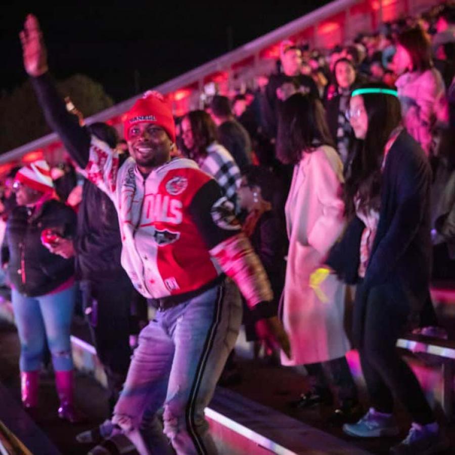 Students dancing at Schoelkopf Stadium