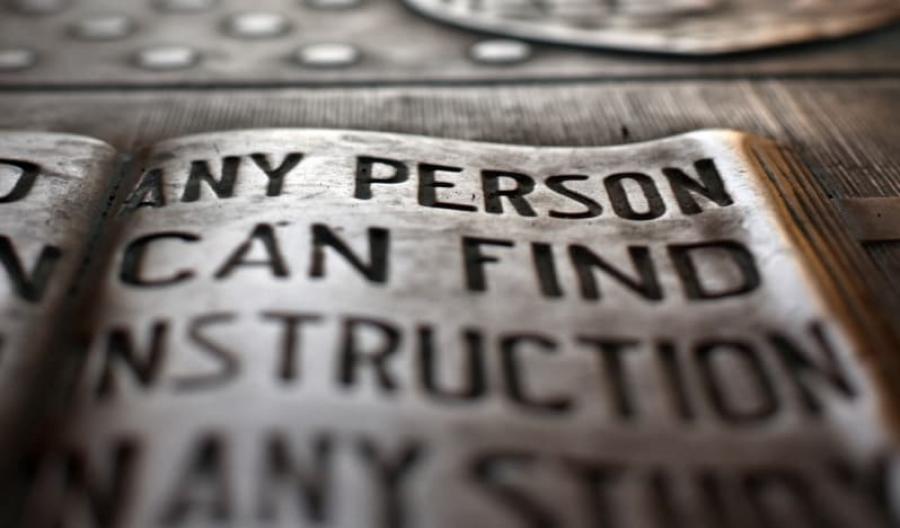 Engraved plaque with Cornell "any person" motto