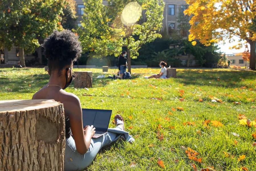 Woman working on the Arts Quad
