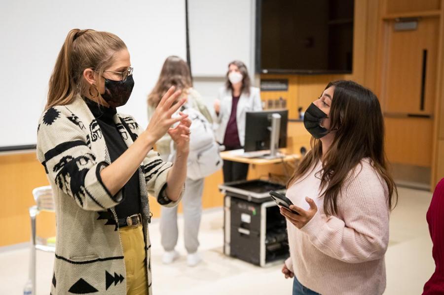 Molly O'Toole speaks with a student