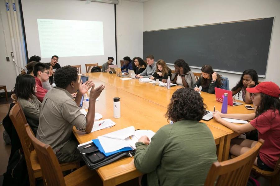 Faculty member teaching small class of students