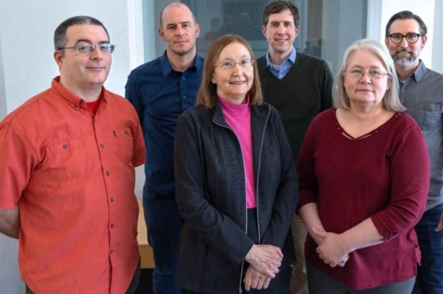 Six people stand together