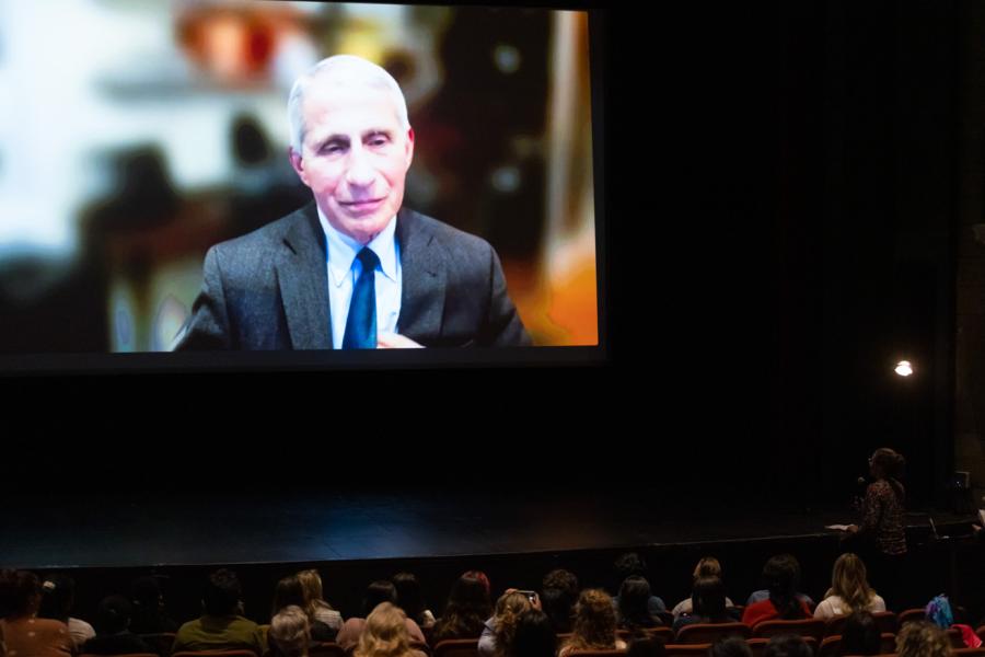 Dr. Anthony Fauci on a large screen