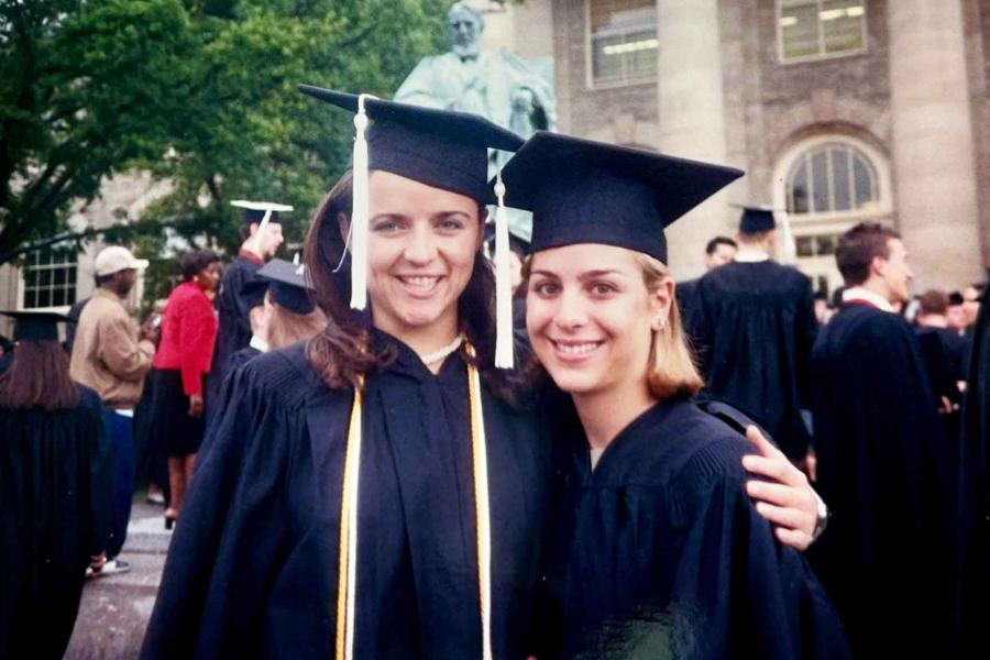 two women in graduation robes
