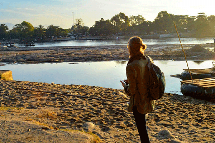 Person stands near a rivier