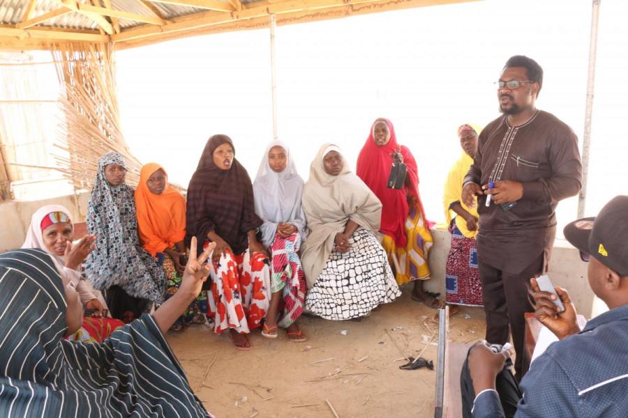 Elaigwu Ameh leading a workshop with internally displaced persons in Nigeria