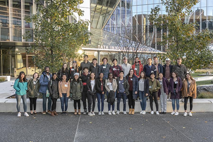 Milstein students stand in front of Cornell Tech buildings in NYC