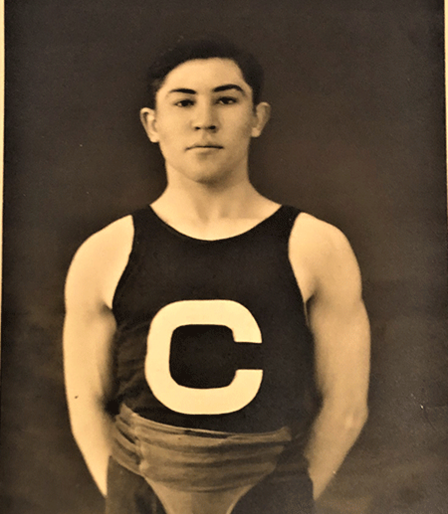 Historic image of man in wrestling uniform.