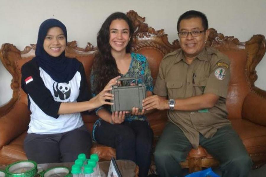 Montana Stone '19, center, is pictured with rhinoceros field researcher Dr. Kurnia Khairani, left, and U Mamat Rahmat, a researcher from Bogor Agricultural University. They are holding a Swift audio recorder, created by the Lab of Ornithology's Bioacoustics Research Program.