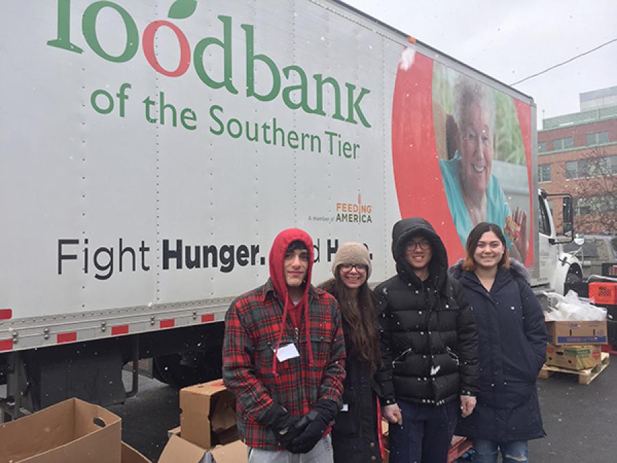 Students outside a food bank truck