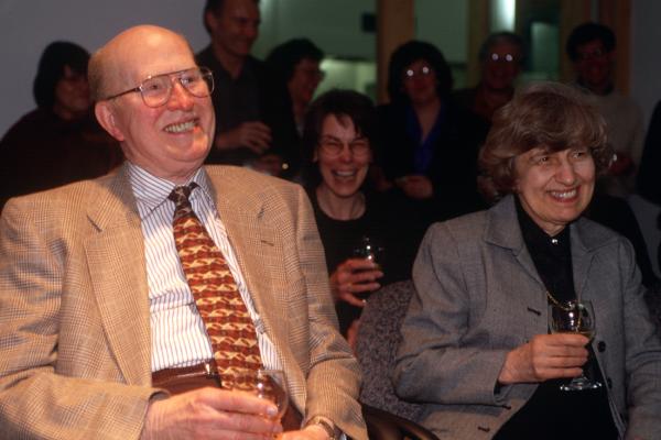People in an audience, smiling
