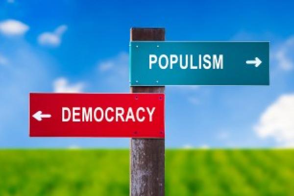 Sign showing Populism going one way and democracy the other