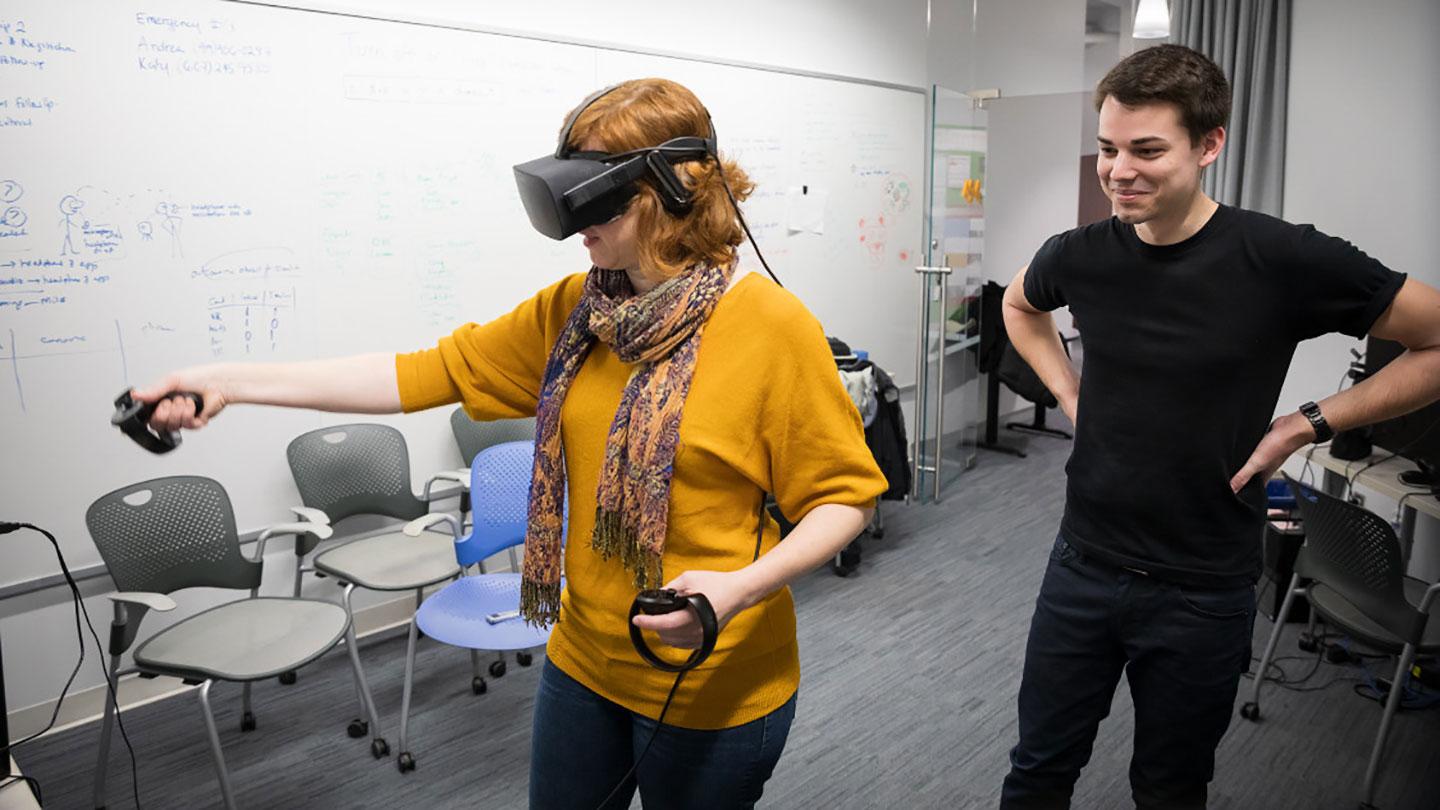 Researchers using VR goggles to study teaching methods