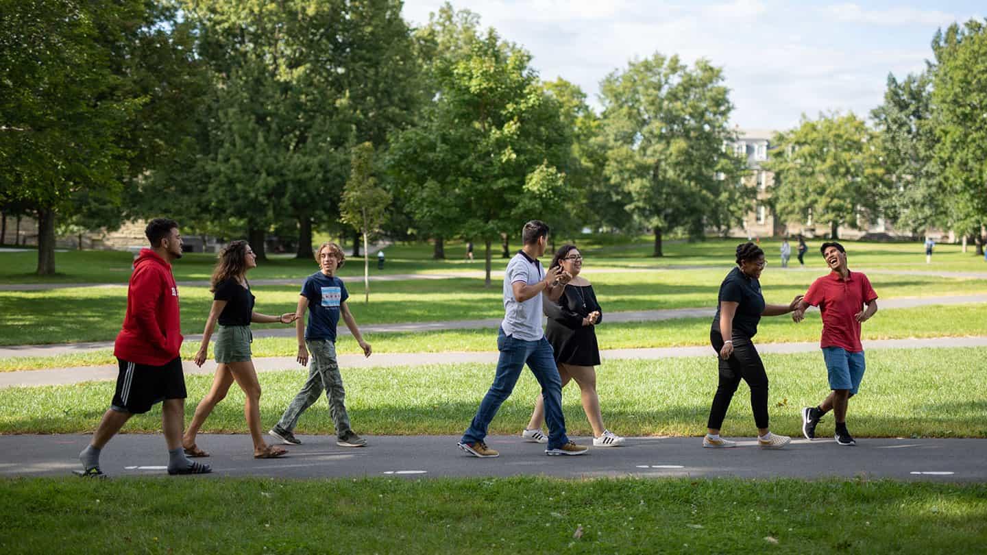 Students walking across the ARts QUad