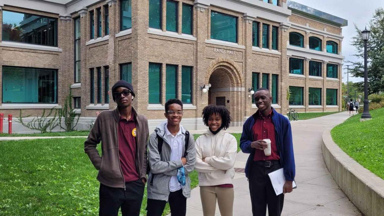 four students at Cornell