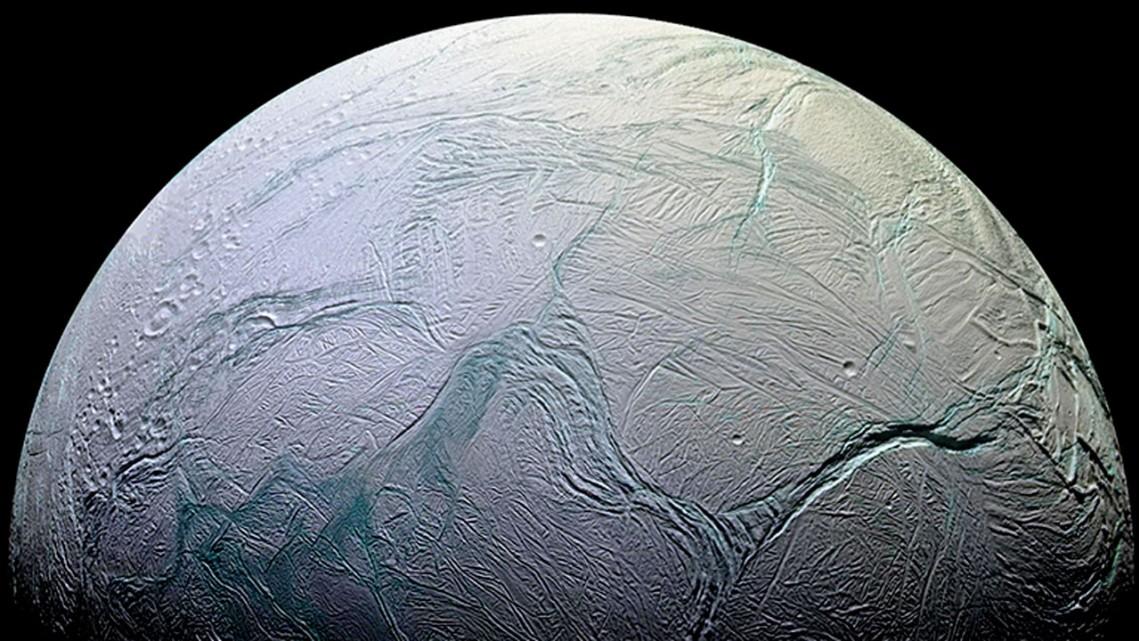Pale, textured celestial body: the moon Enceladus