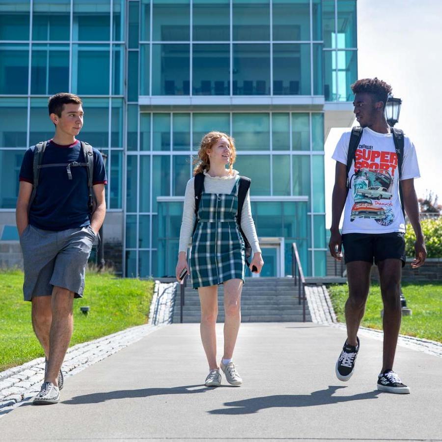Three students in the Pre-Freshman Summer Program near the Physical Science Building.