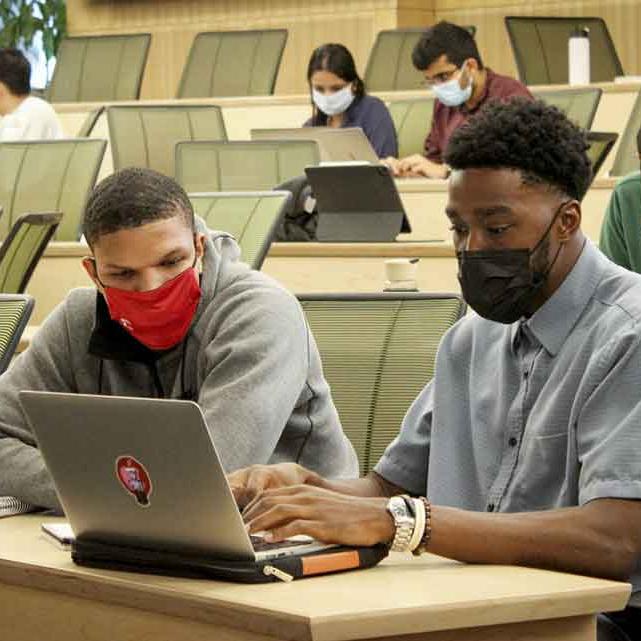 students working together on a computer