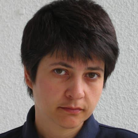Headshot of Irena Peeva with short black hair