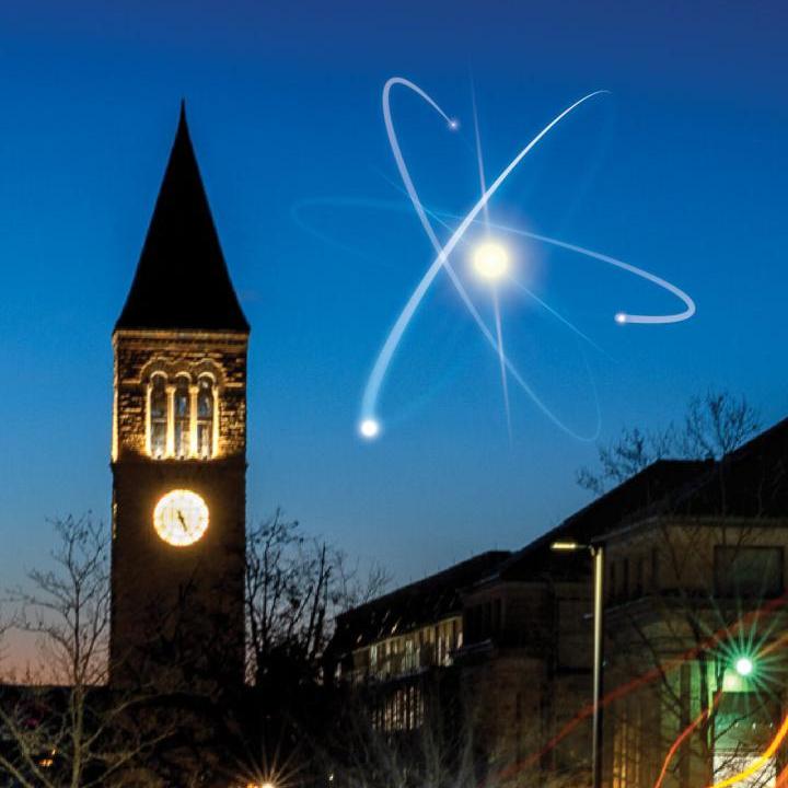 An artist's rendition of an atom in the sky next to McGraw Tower on Cornell's campus.