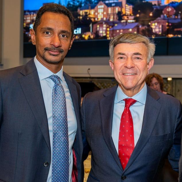 Three people wearing suits